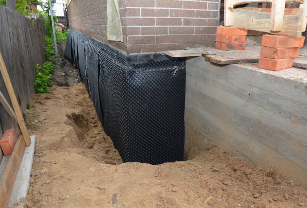 SJ Waterproofing Pros technician performing targeted Vapor Barrier Installation assessment in Springfield, OH